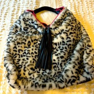 Faux leather, faux fur, black purse, trimmed in pink with tassels!